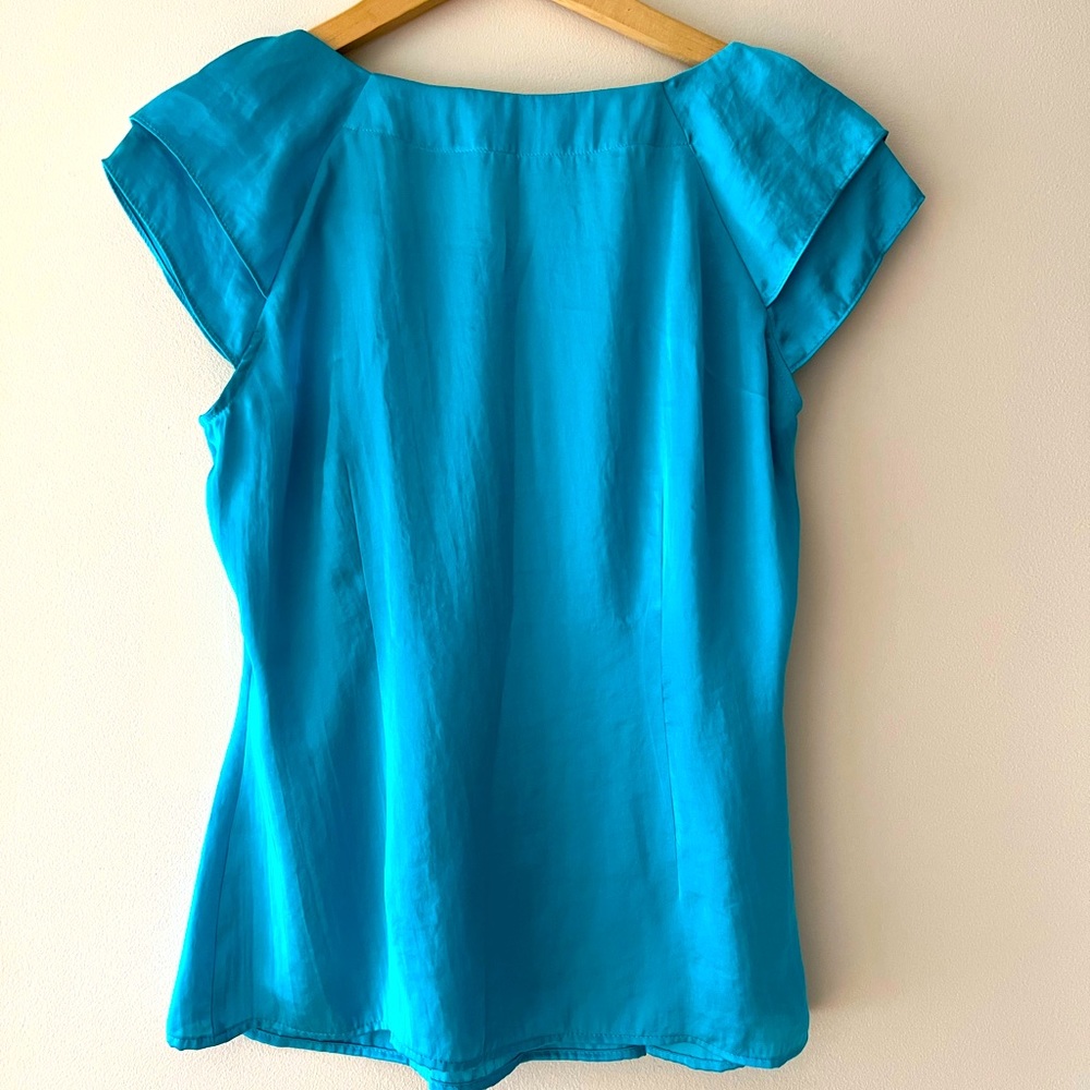 this blue blouse that would be nice for dinner or ect.The size is medium